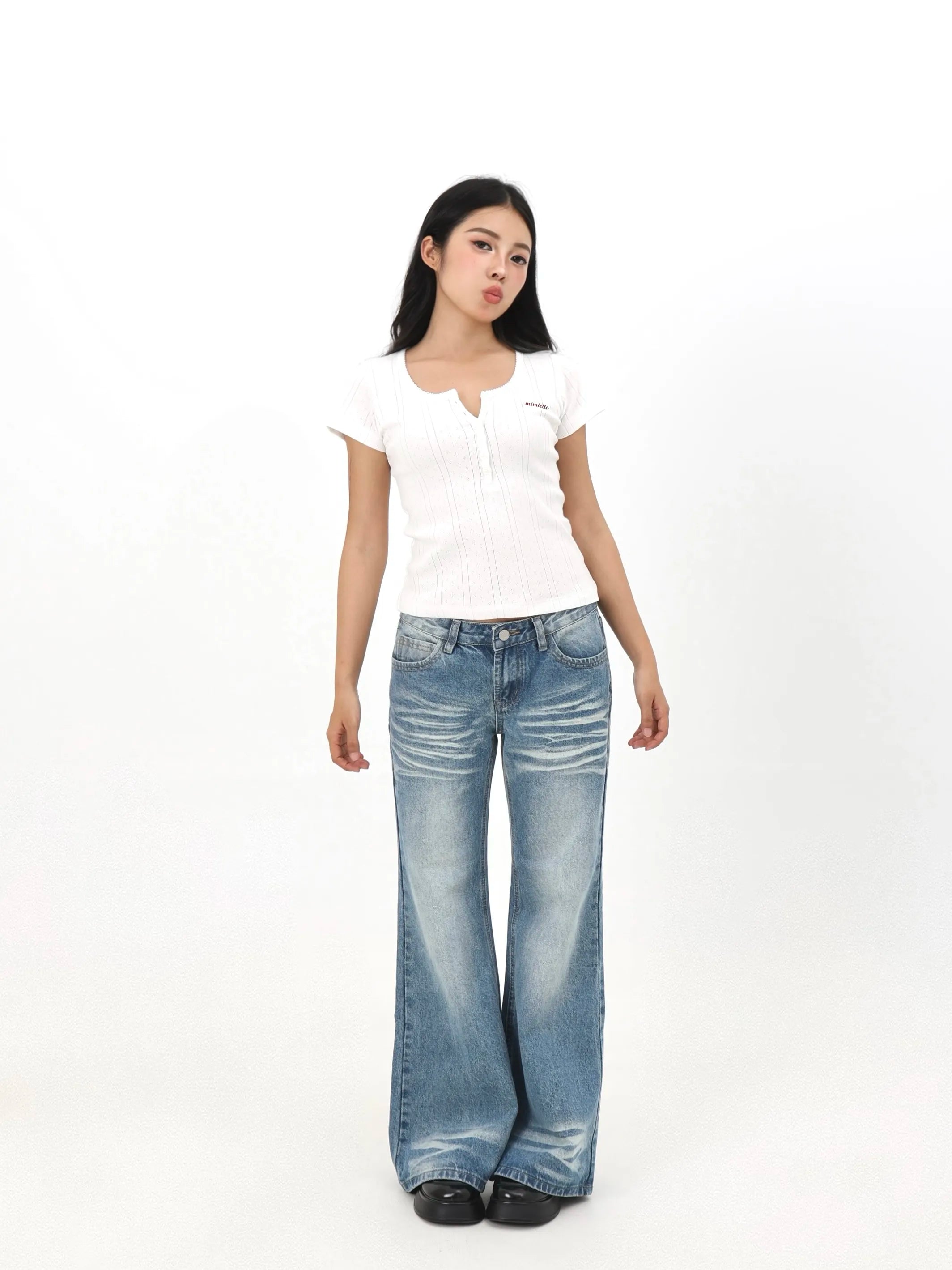 Distressed wash low-rise relaxed fit wide-leg jeans with creased hem