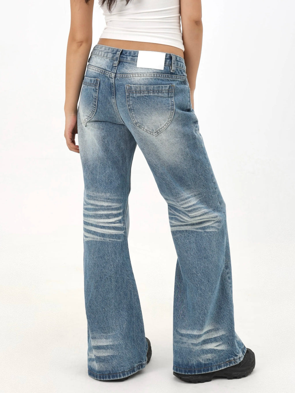 Distressed wash low-rise relaxed fit wide-leg jeans with creased hem