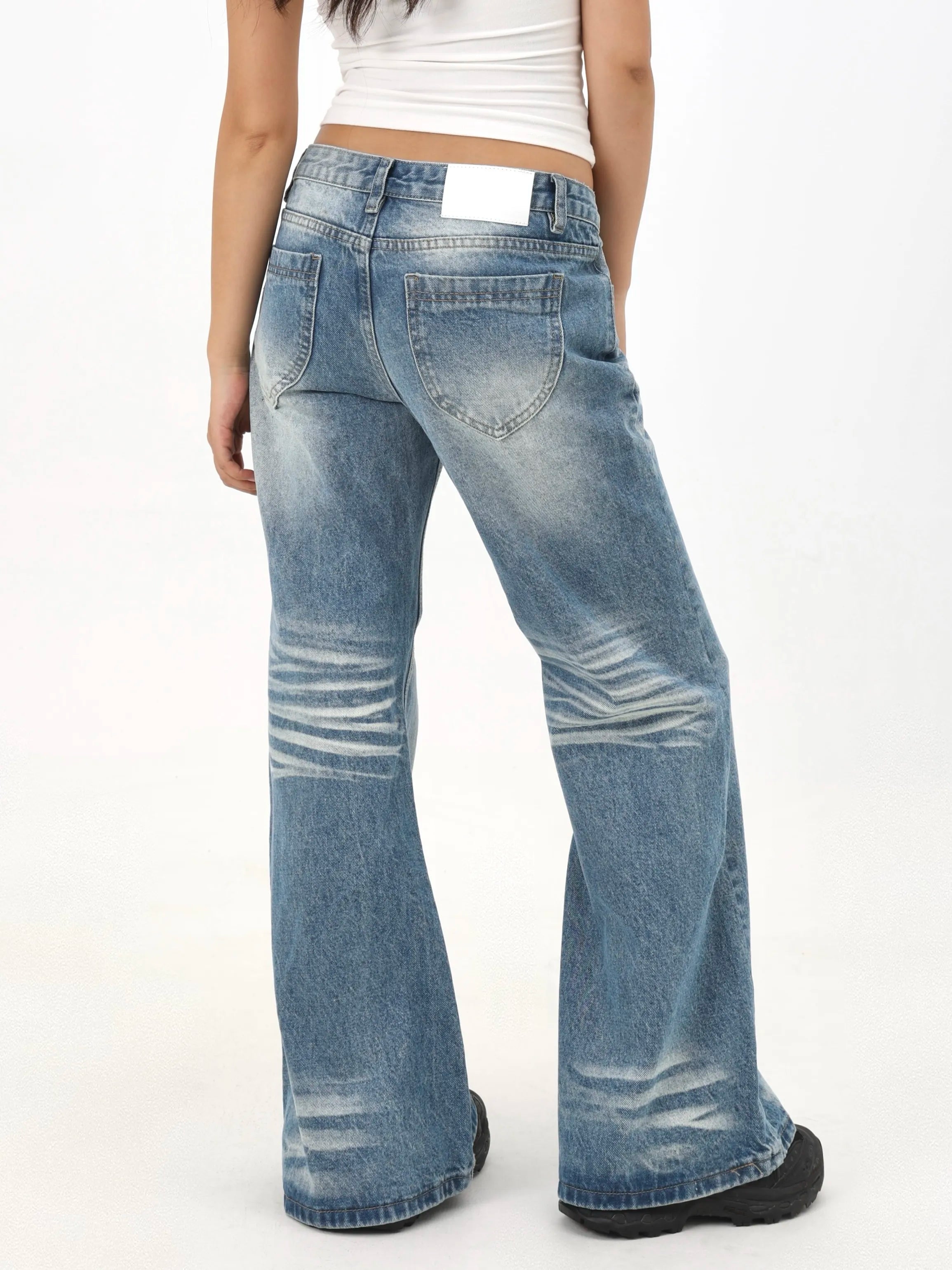 Distressed wash low-rise relaxed fit wide-leg jeans with creased hem