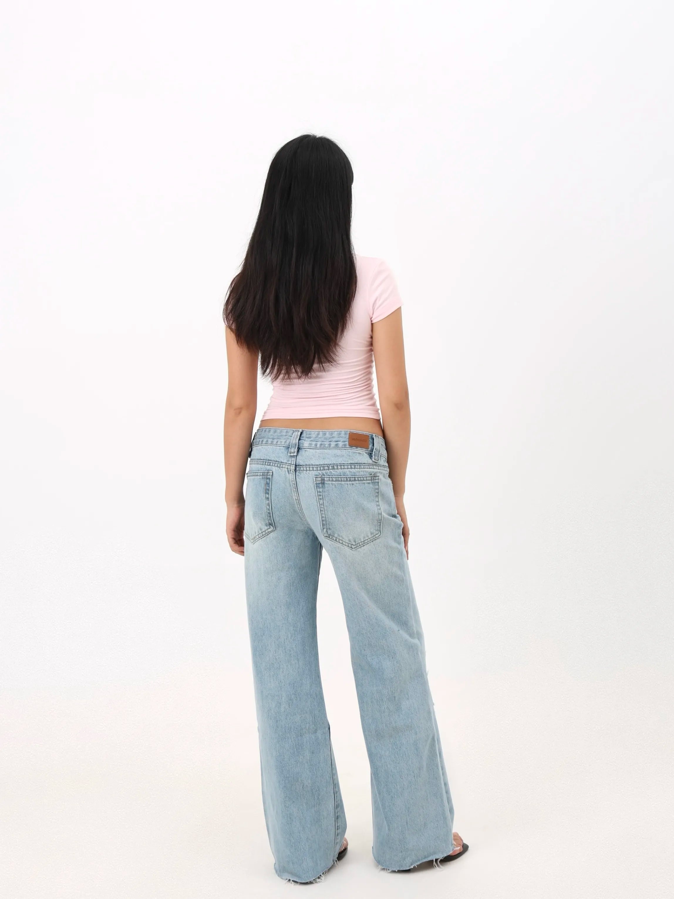 Low-rise straight-leg ripped jeans