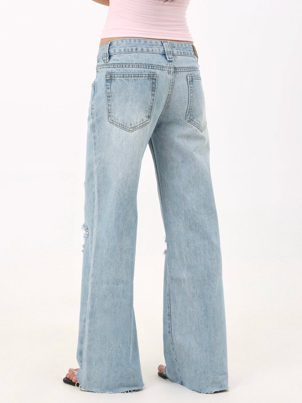 Low-rise straight-leg ripped jeans