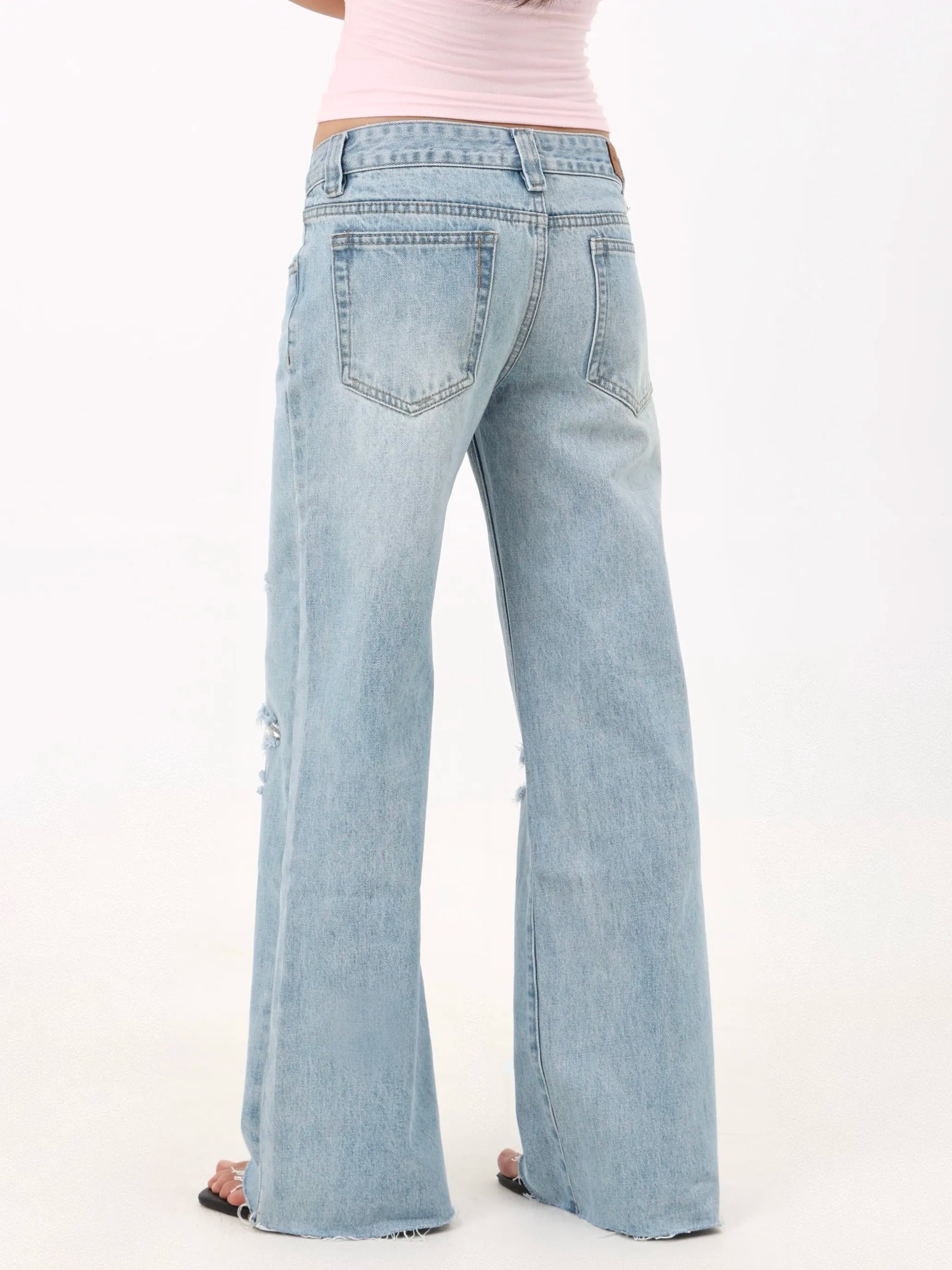 Low-rise straight-leg ripped jeans