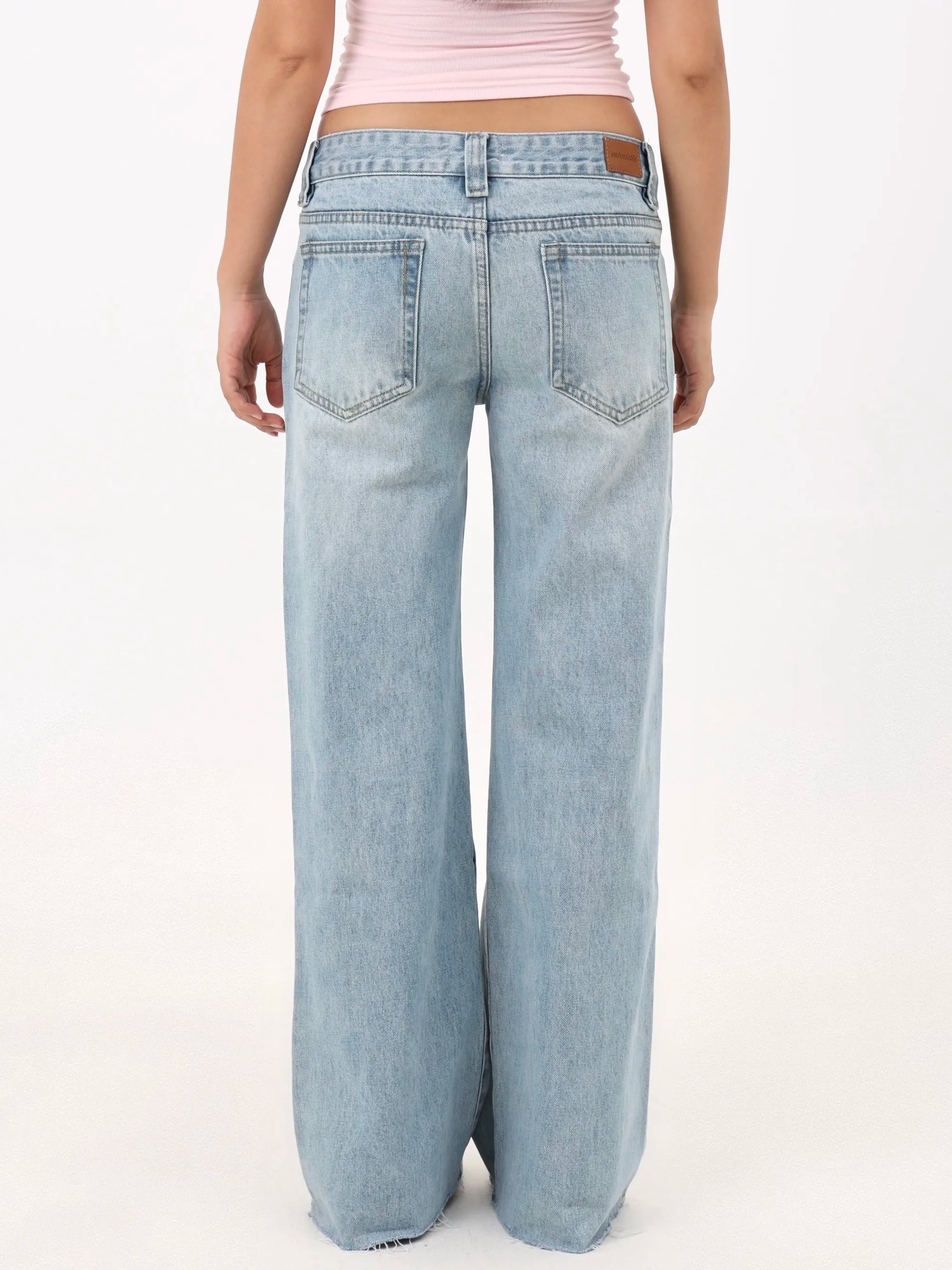 Low-rise straight-leg ripped jeans