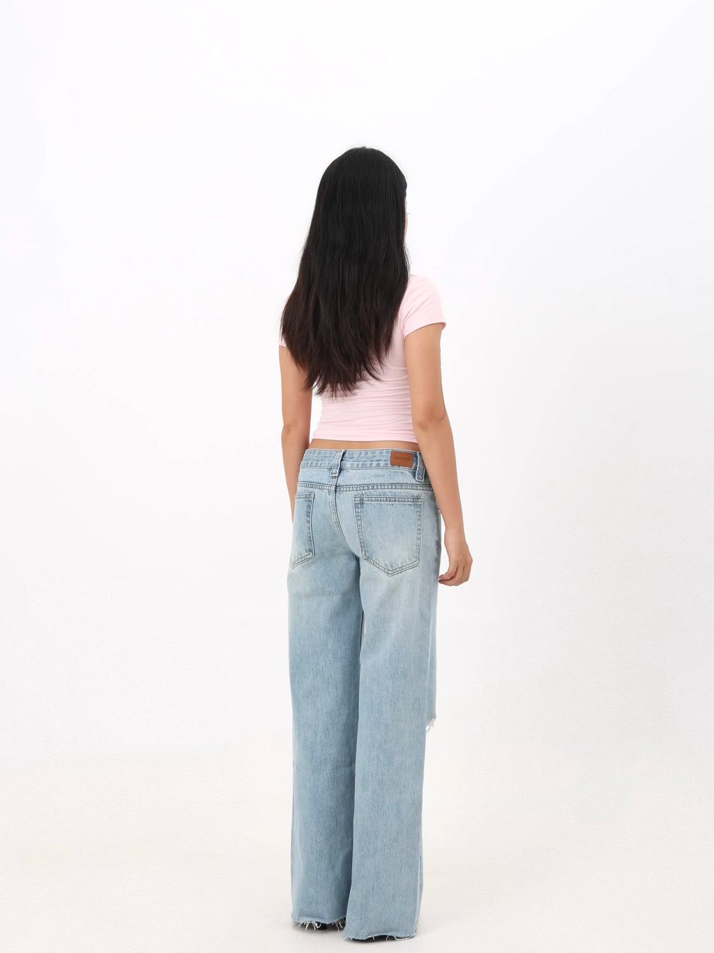 Low-rise straight-leg ripped jeans