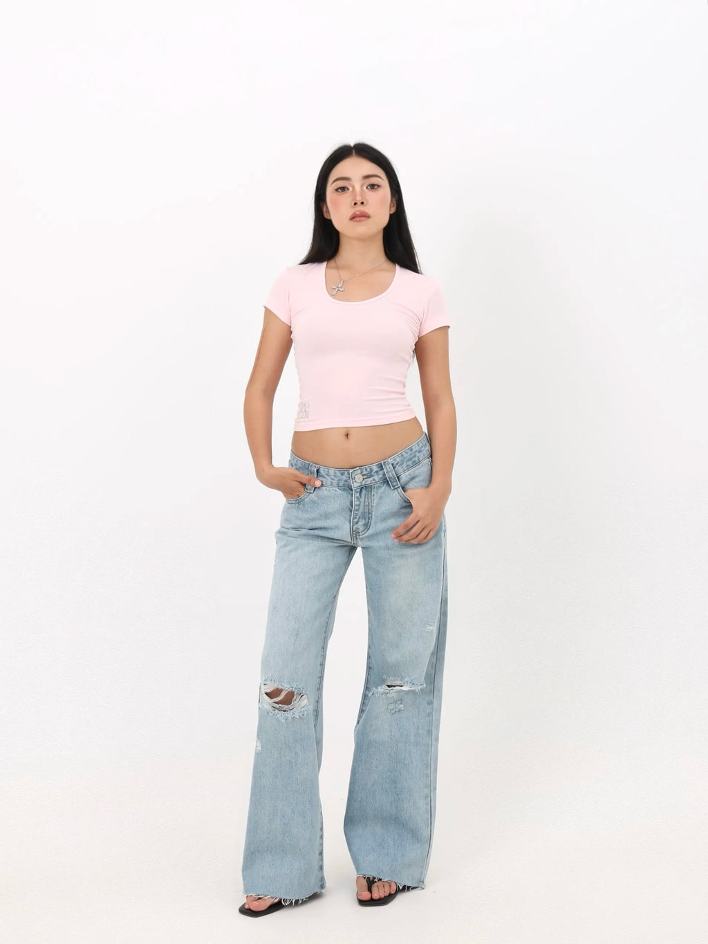 Low-rise straight-leg ripped jeans