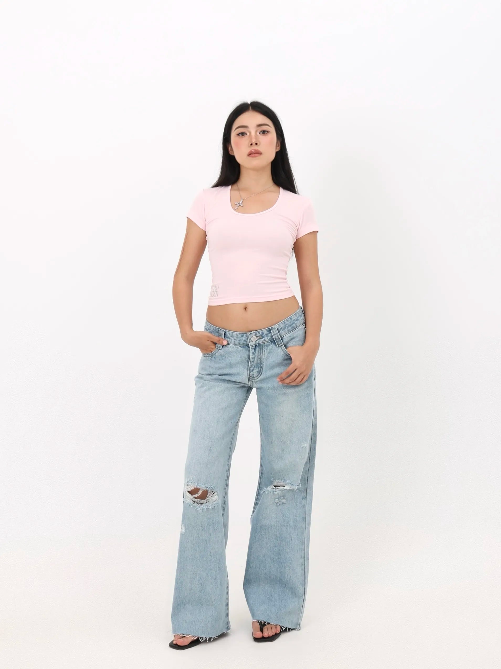 Low-rise straight-leg ripped jeans