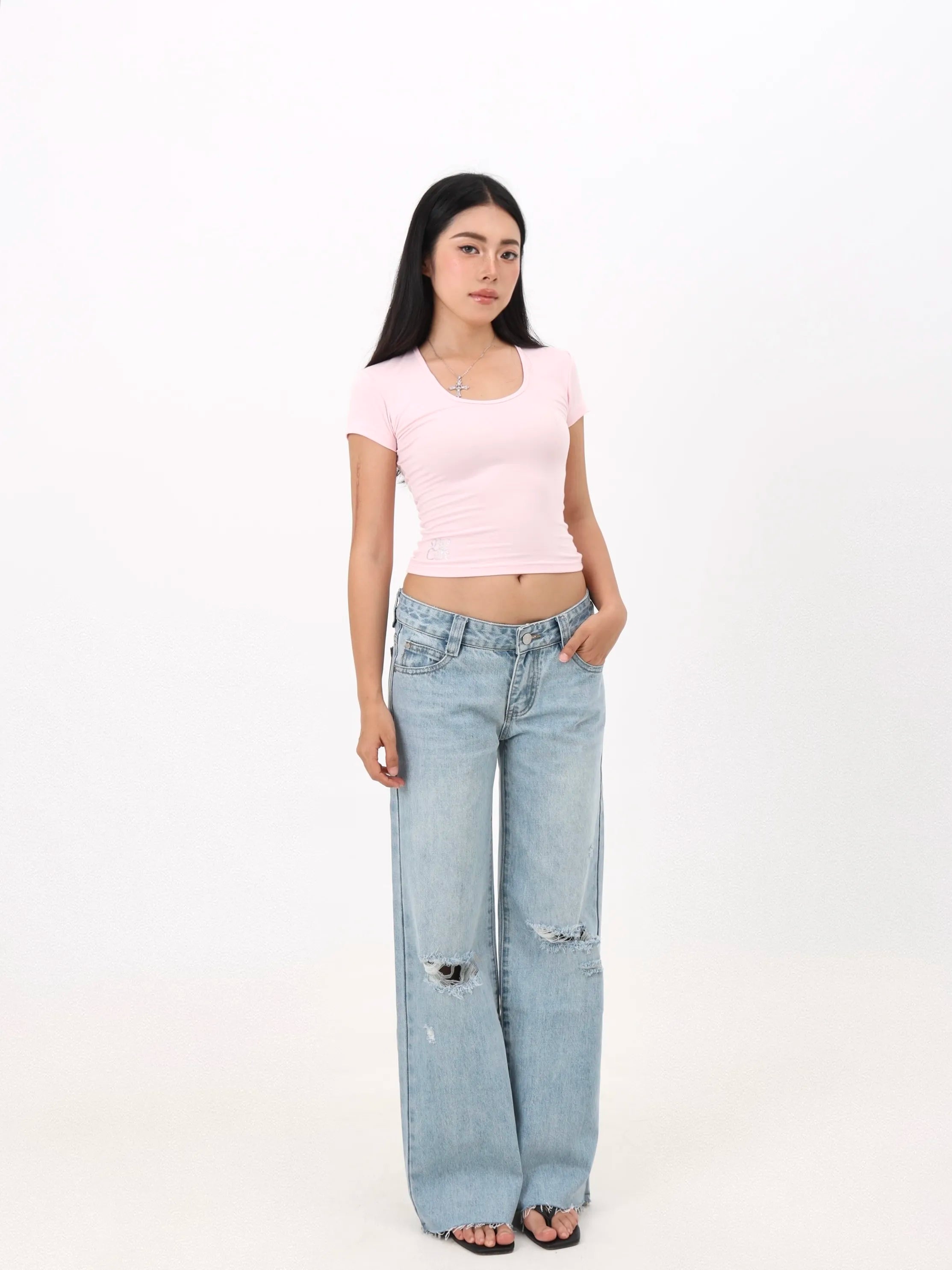 Low-rise straight-leg ripped jeans