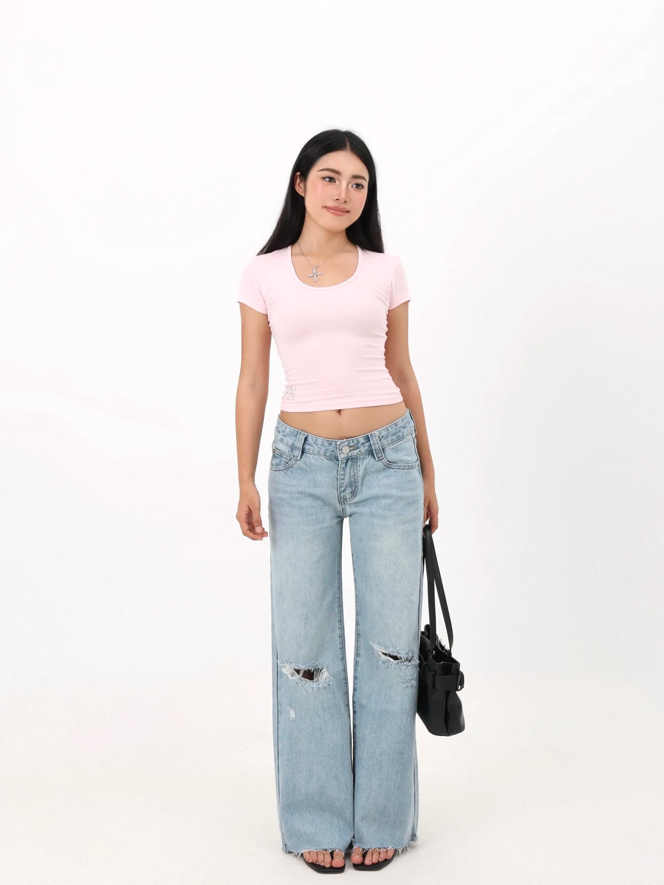 Low-rise straight-leg ripped jeans